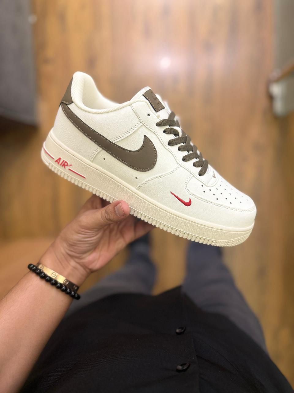 Nike Air Force 1 Low – Cream with Brown Swoosh & Red Mini Logo