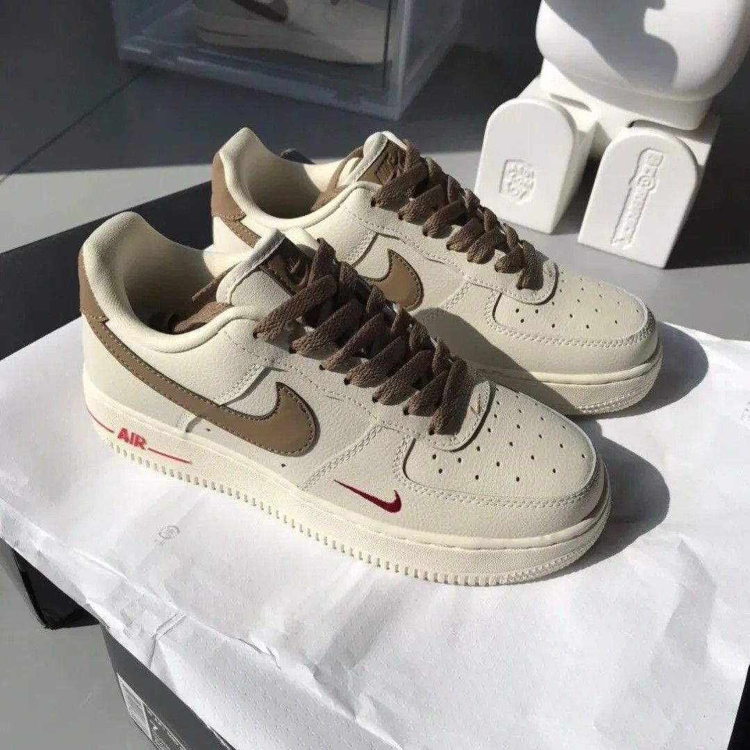 Nike Air Force 1 Low – Cream with Brown Swoosh & Red Mini Logo