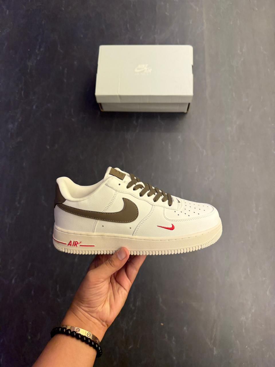 Nike Air Force 1 Low – Cream with Brown Swoosh & Red Mini Logo
