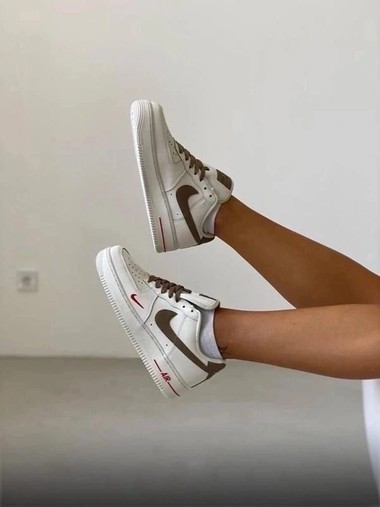 Nike Air Force 1 Low – Cream with Brown Swoosh & Red Mini Logo